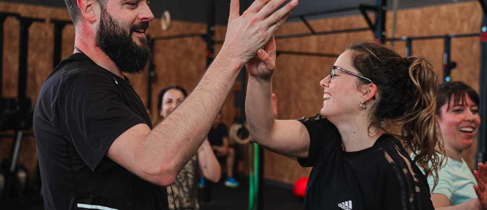 Entrenadores de Midland CrossFit saludando y dando la bienvenida